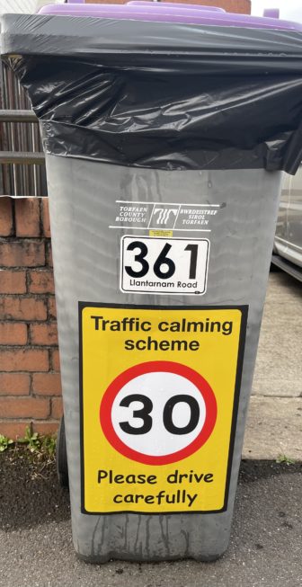 A bin with a 30mph sticker