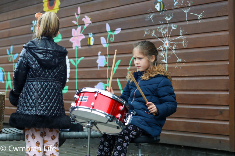 A girl plays the drum
