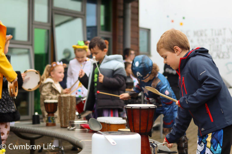 A boy plays the drum