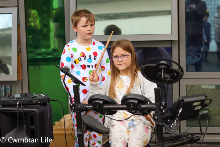 A girl plays the drums