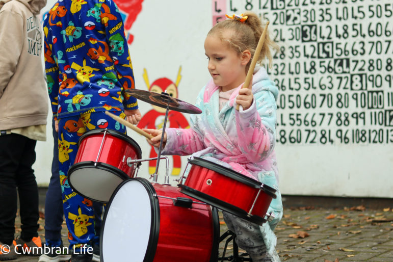 A girl plays the drums