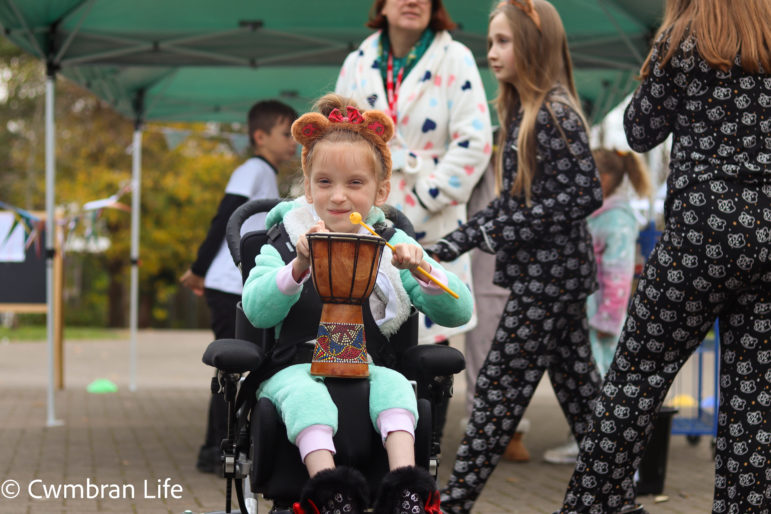 A girl plays the drums