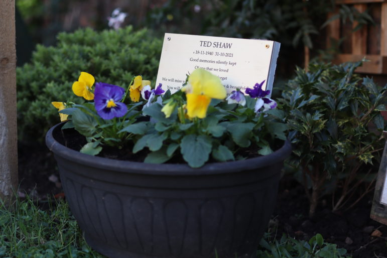 A memorial plaque in flowers