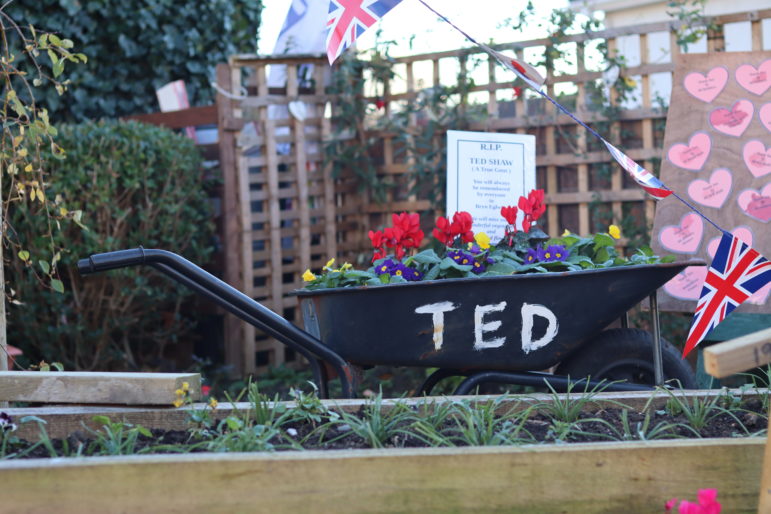 A floral tribute in a wheelbarrow