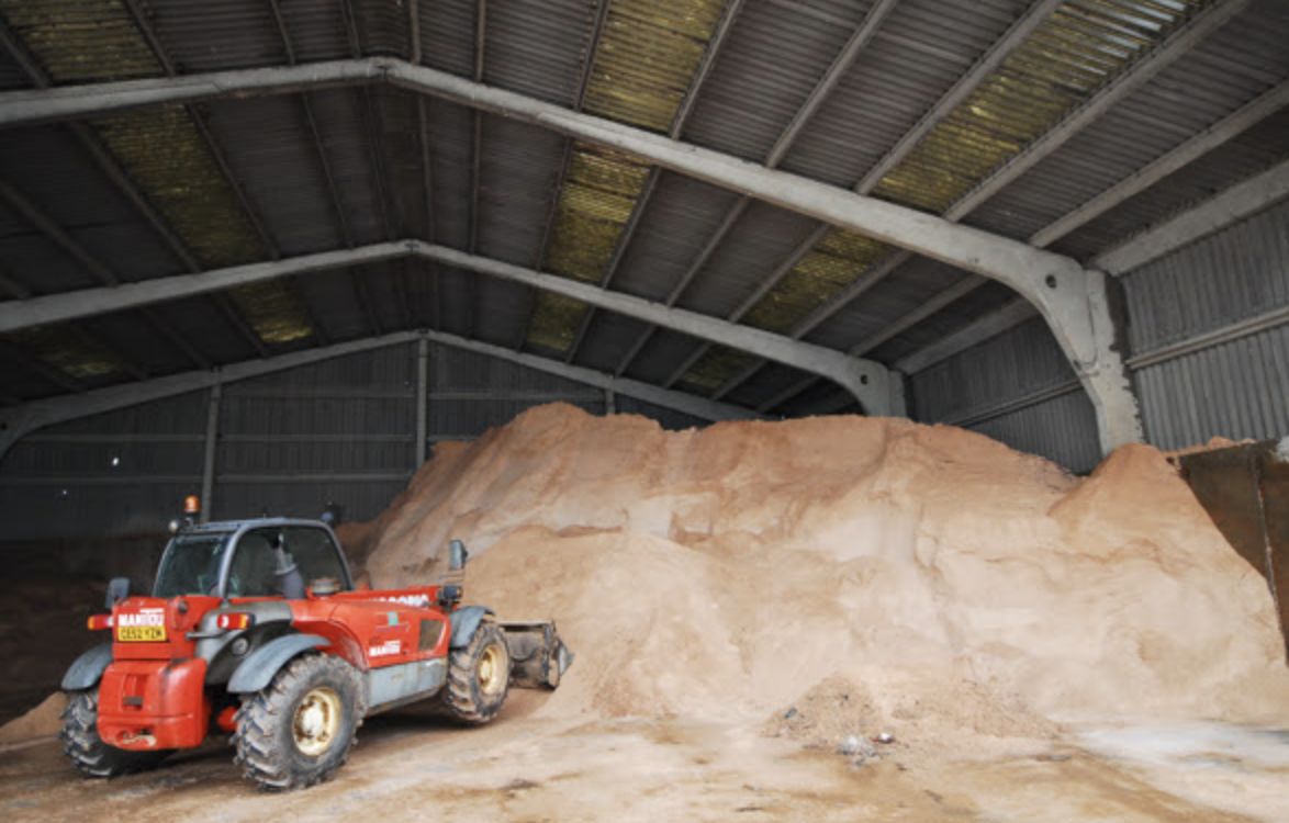 A tractor and a mount of grit