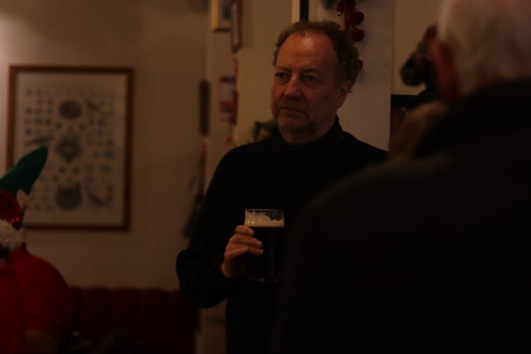 a man holding a beer