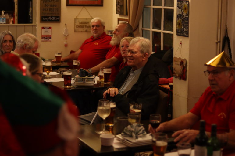 a group of people in a pub