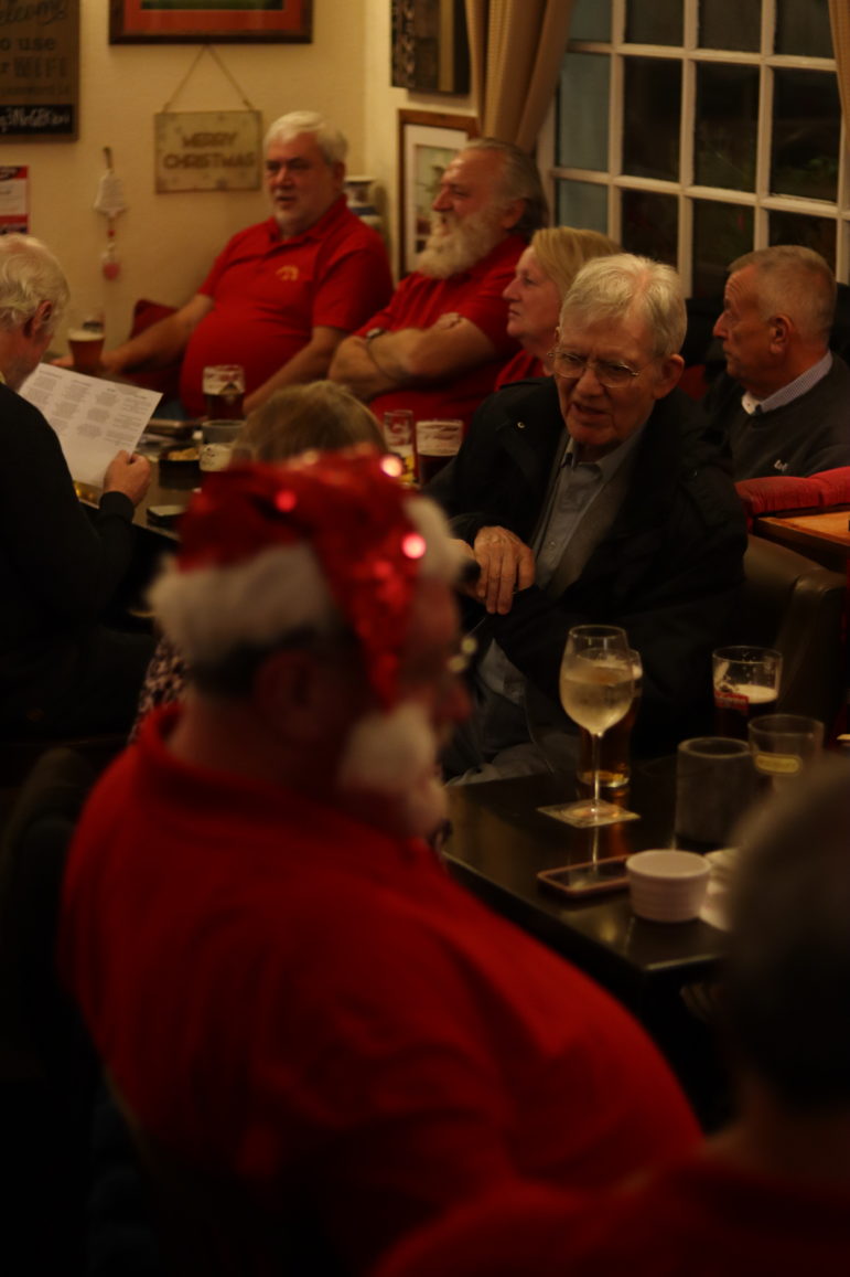 a group of people in a pub