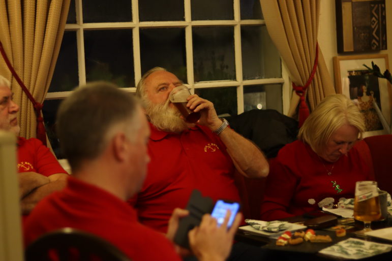 a man drinking a beer