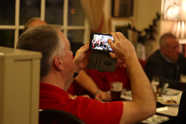 a man taking photo on mobile phone