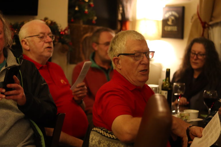 people singing in a pub