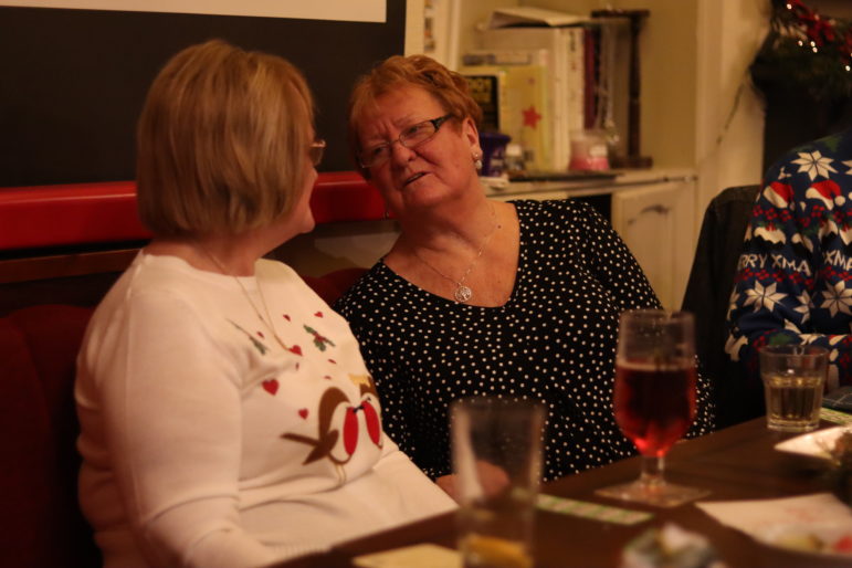 two women talking in a pub