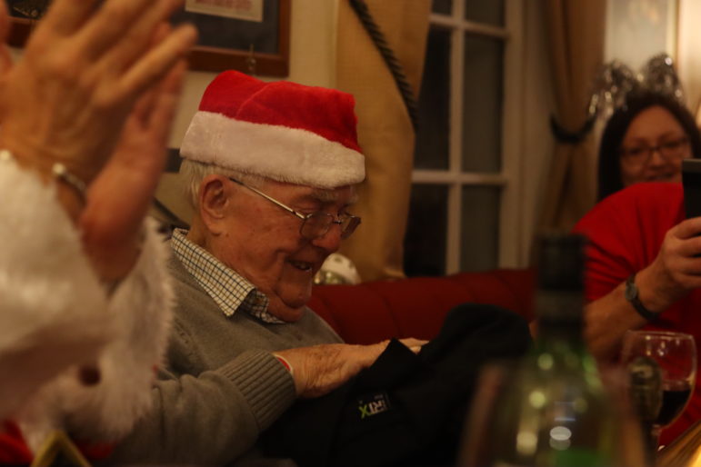 man opening present