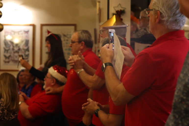 men in red shirts