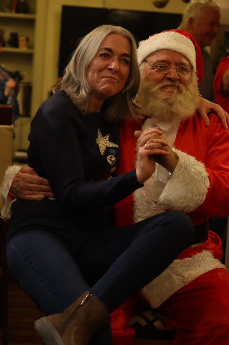a woman on santa's lap