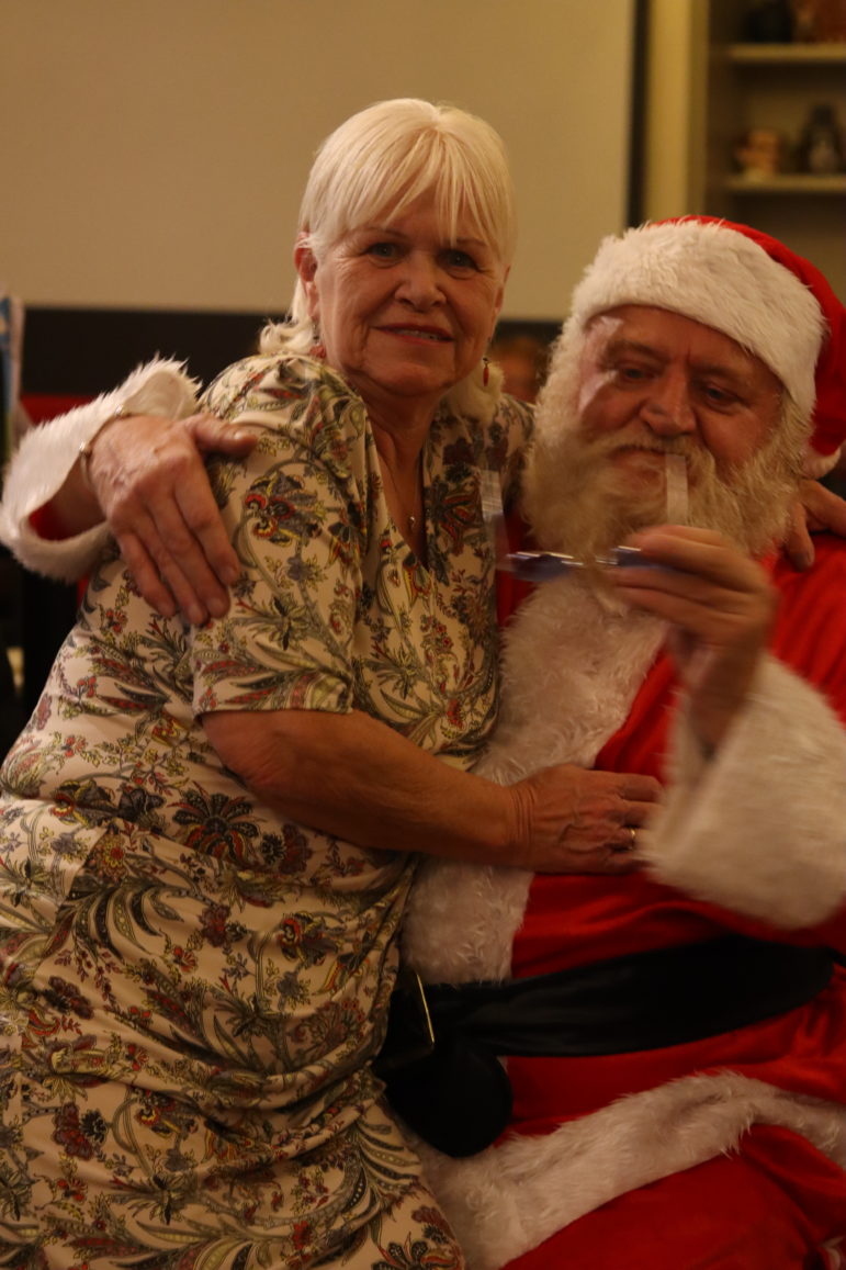 a woman on santa's lap