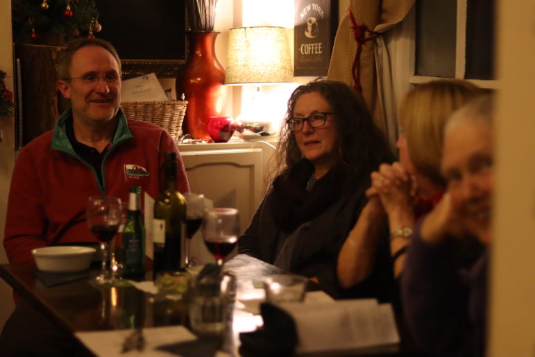 four people sat at a pub table