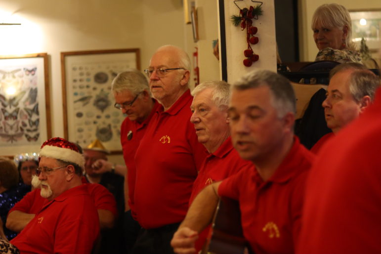 men singing in a pub