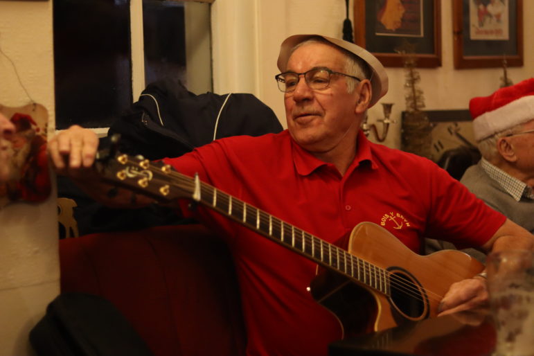 a man holding a guitar