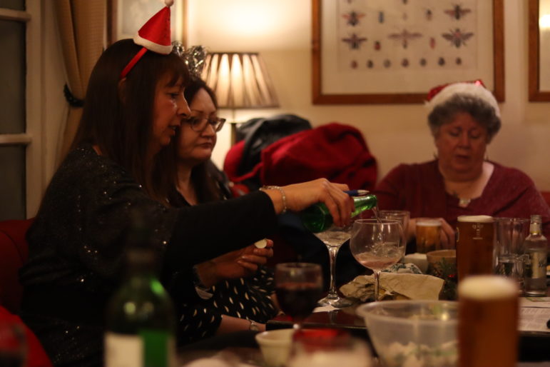 a woman pouring a drink