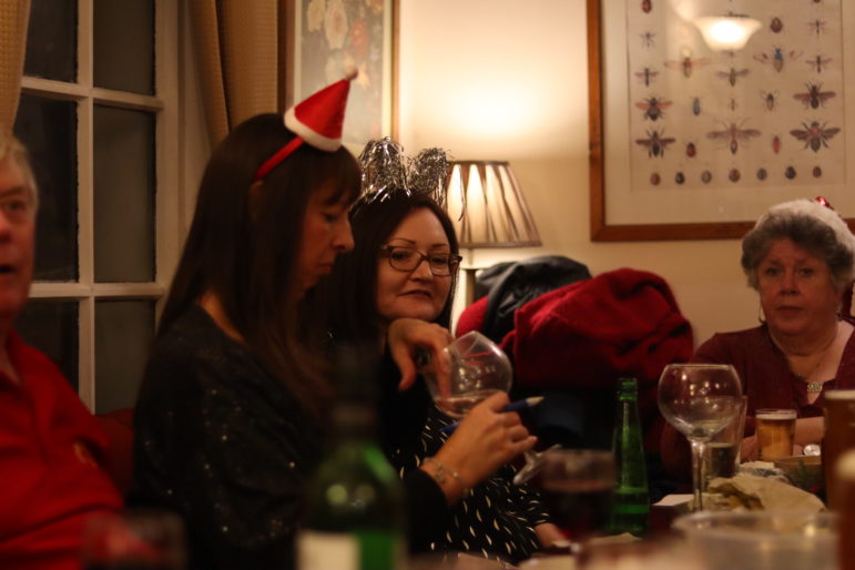 a woman grabbing ice from a glass