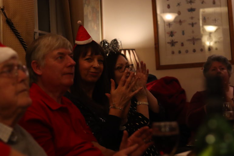 two women clapping