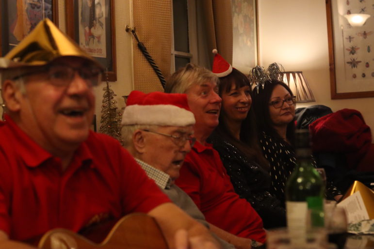 people singing in a pub