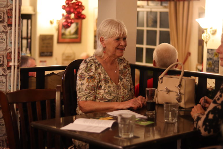 a woman at a pub table