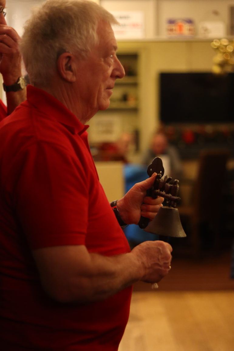 a man ringing a bell