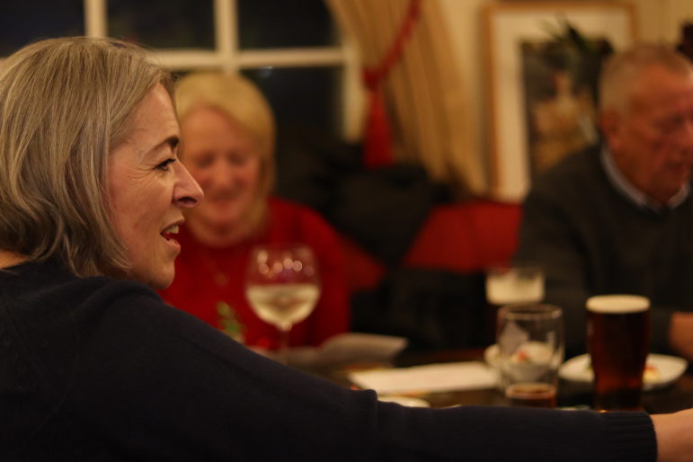 A woman at a pub table