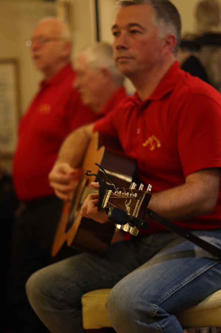 man playing a guitar