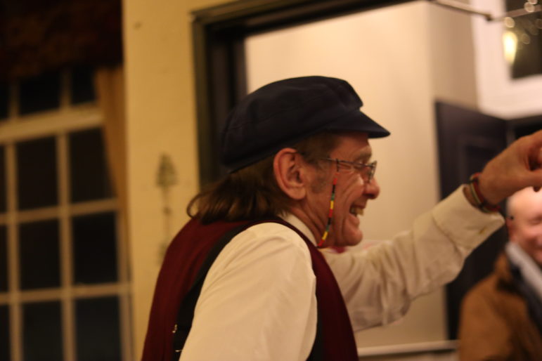 man laughing in pub