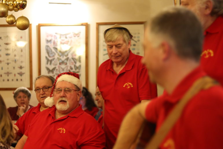 men singing in pub