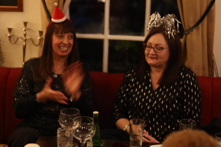 woman clapping in pub