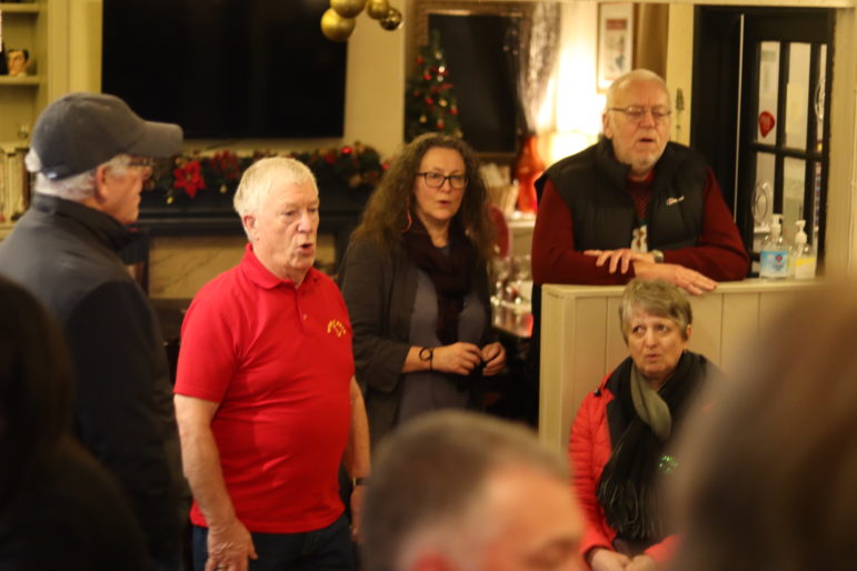 man singing in pub