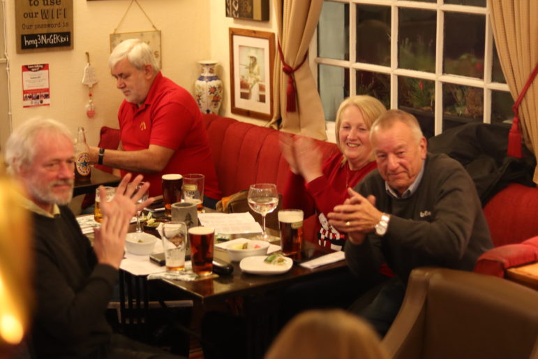 table of people clapping