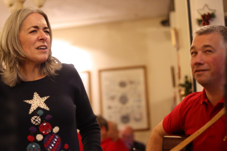 a woman and man in pub