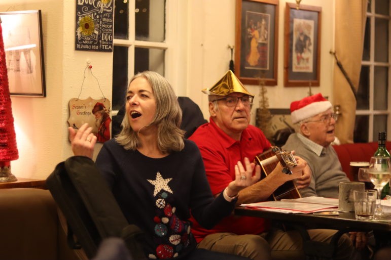 A woman singing in pub