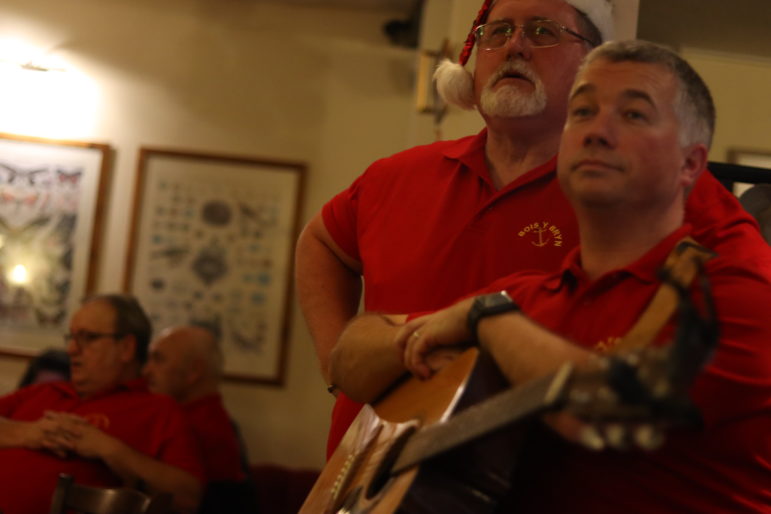 a man holding a guitar