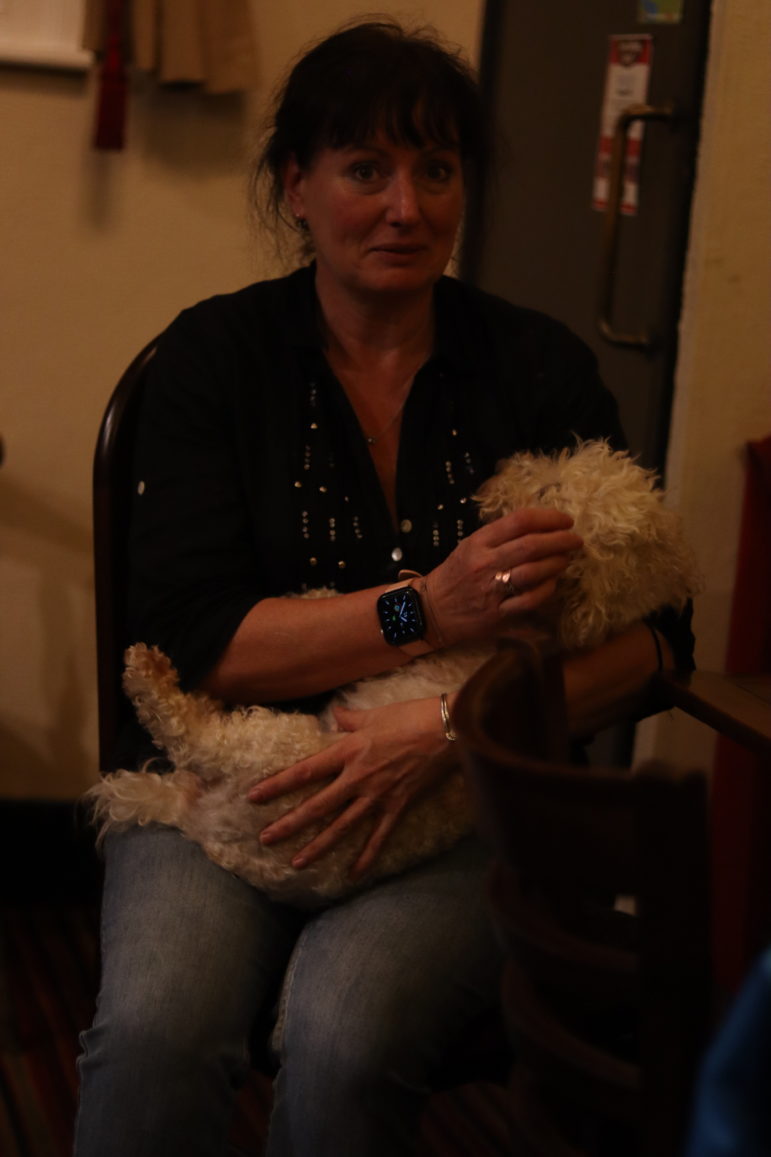 a woman holding a dogr
