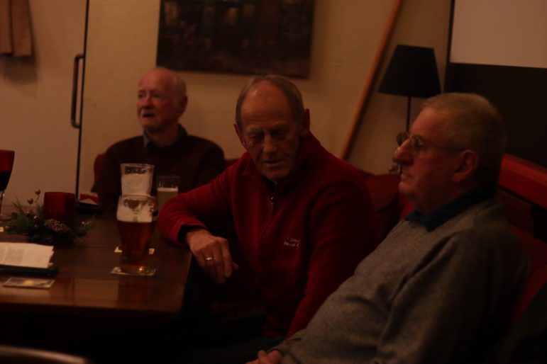 Three men at a pub table