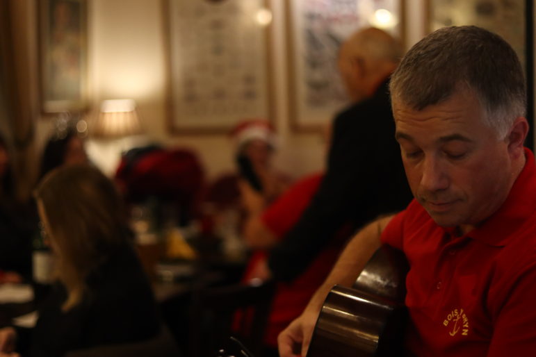 a man on a guitar