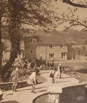 Front cover of the book showing children in a street