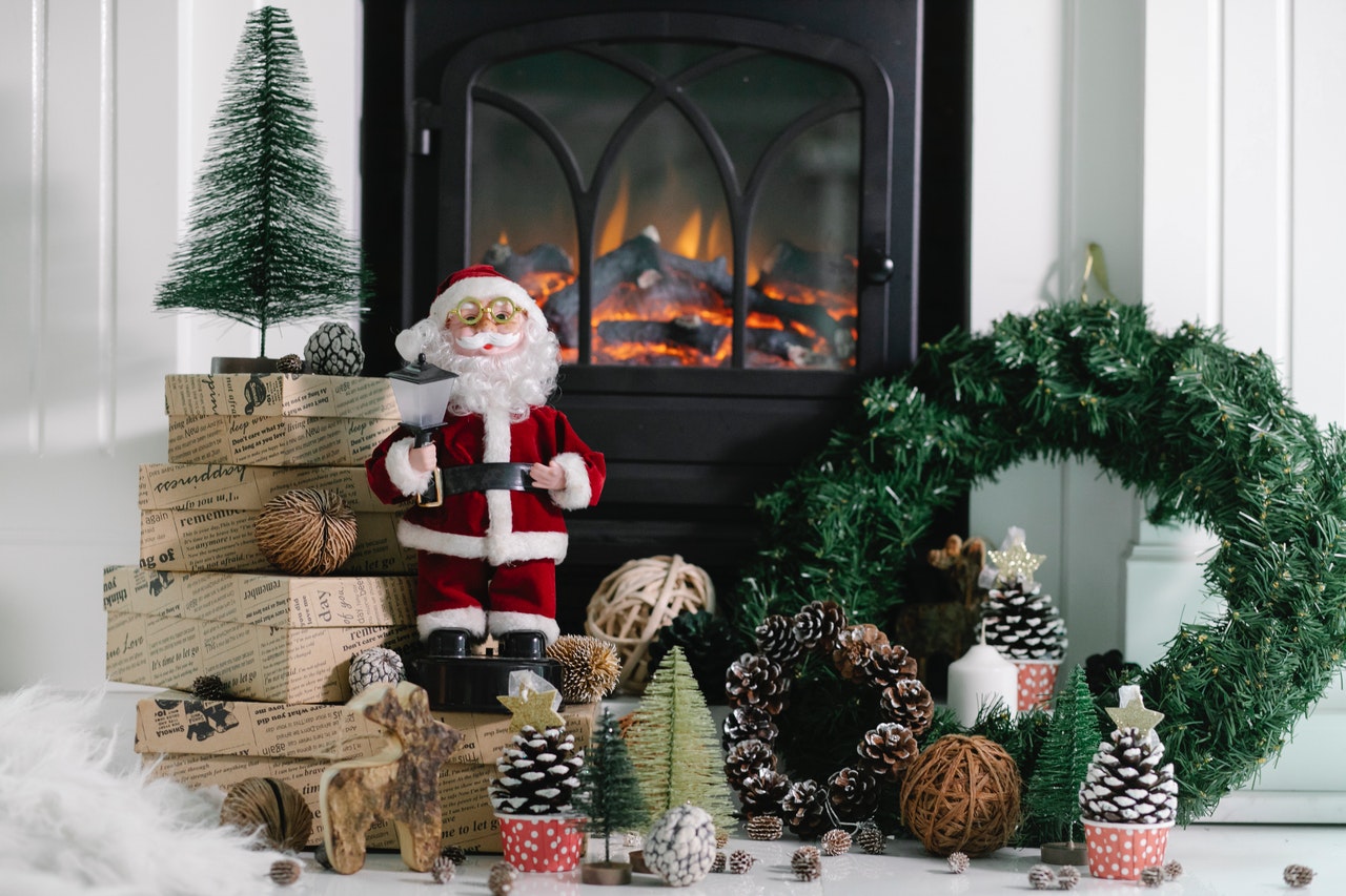 A gas fire with Christmas decorations around it