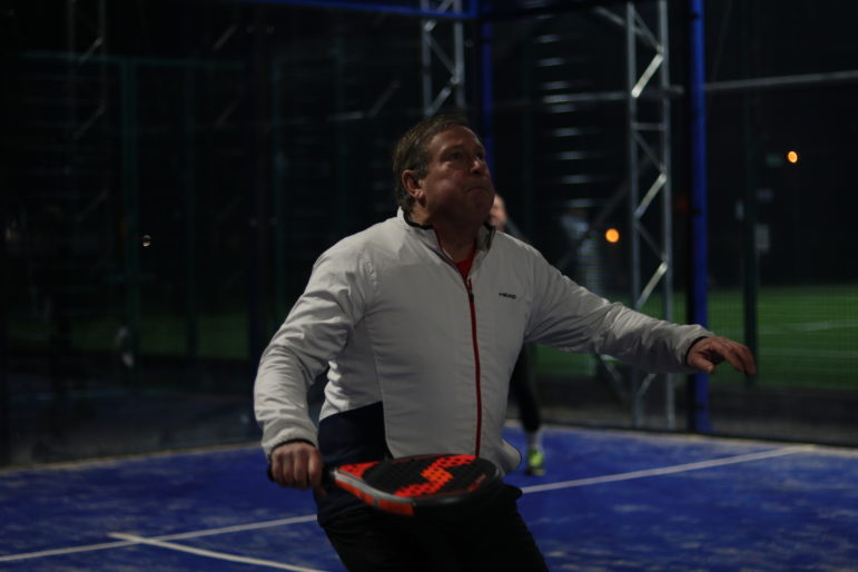 a man playing padel tennis