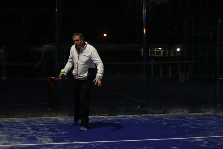 a man playing padel tennis