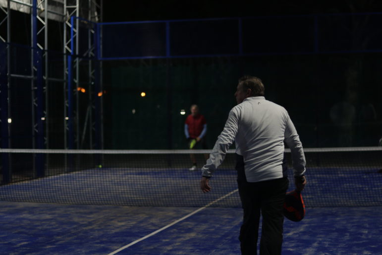 a man playing padel tennis