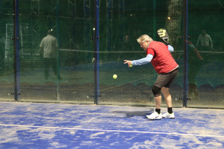 a man playing padel tennis