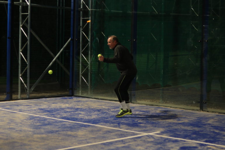a man playing padel tennis