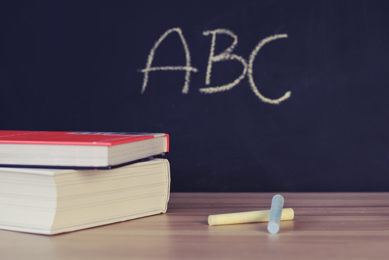 School books and a chalkboard